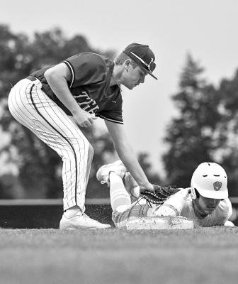 A tag for a Tigers’ out at first base in Mount Vernon Friday. Photos by Trey Pope