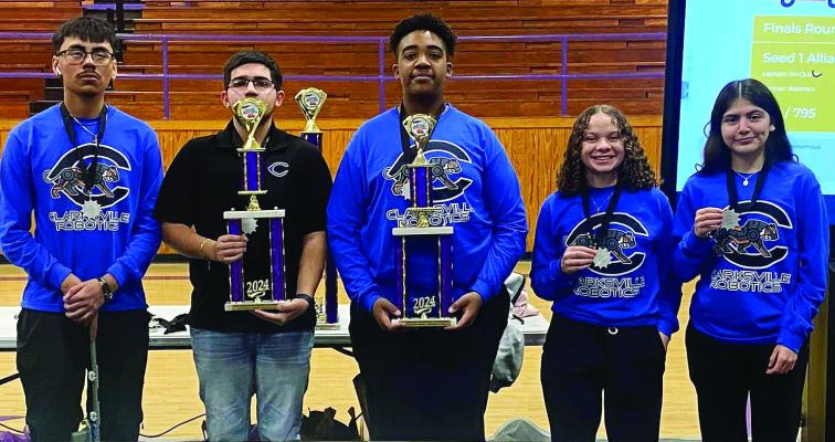CISD Robotics team Teen Titans Gil Lopez and Adrian Valdez and team LBB Larry Turner, Alicia Love and Yanet Resendiz earn second place trophies for their alliance at the Meadow ISD BroncoBot Bowl. Courtesy photos