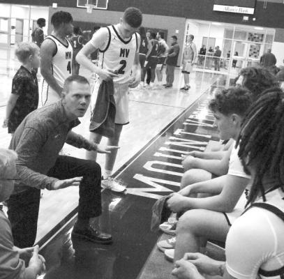 Mount Vernon Tigers boys basketball coach Brian Jacobs talks to his players during a timeout at home court in December.. Photo by Allen D. Fisher