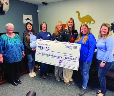 Staff members of the Northeast Texas Child Advocacy Center accept a donation made by the CHRISTUS Mother Francis Hospital in Winnsboro. Courtesy photo