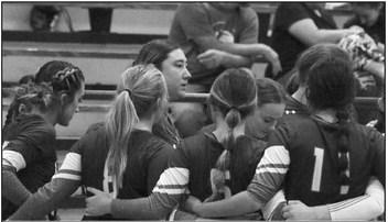 Lady Rebels team talk strategy. Photo by Allen D. Fisher