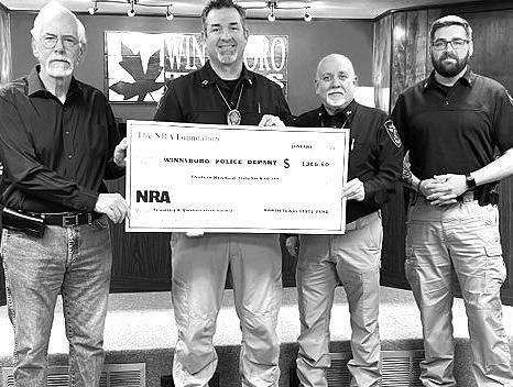 The Winnsboro Police Department were awarded a grant from the NRA Foundation for training and qualification ammunition. Pictured from left is Scott Roeder, Friends of the NRA Volunteer, Captain Chris Hill, Chief Andy Chester and Sgt. Ryan Brown. Courtesy Photo