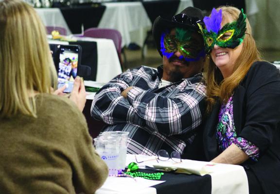 Winnsboro area business members attend the Mardi Gras themed masquerade banquet, hosted by the Winnsboro Area Chamber of Commerce. Photo by Ashley Barner