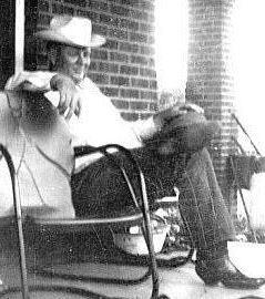 In a picture taken around 1950, Charles Hughes relaxes on the porch of the house on East Main. Courtesy photo