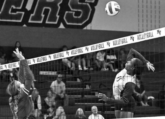Mount Vernon Lady Tigers’ Aaliyah Traylor goes up for kill in their season opener at home against Paul Pewitt last week. Photo by Trey Pope