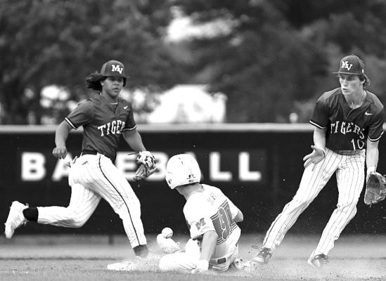 An error on the throw to second base sent Tigers scrambling. Photos by Trey Pope