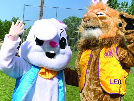 The Easter Bunny and Leo the Lion pose for candid pictures at Easter in the Park in Mount Vernon Saturday. Lillie Bush-Reves