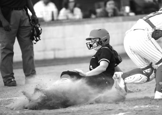 Coming in Hot: Devin Grimes slides into home plate in the sixthinning of Winnsboro’s 15-8 win at Harmony on Tuesday. Photos by Shiela K. Haynes
