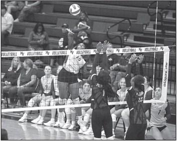 Above, Mount Vernon Lady Tigers’ #15 Aaliyah Traylor makes a kill at the net. Photos by Trey Pope